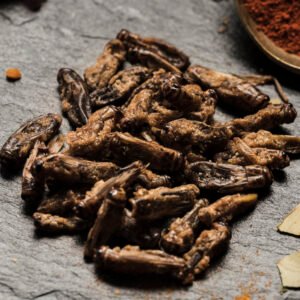 close view crispy maggots slate board