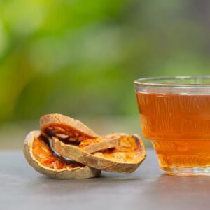 hot dry bael fruit tea in a thai herbal cup