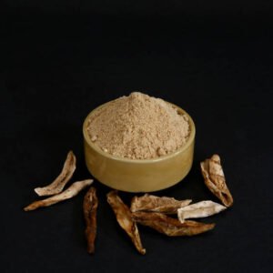 aamchoor powder in a bowl on black surface