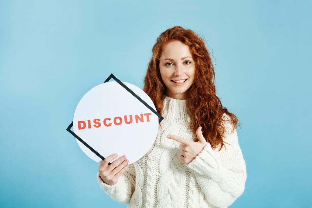 How to Apply Discount Coupons smiling girl showing banner of sale