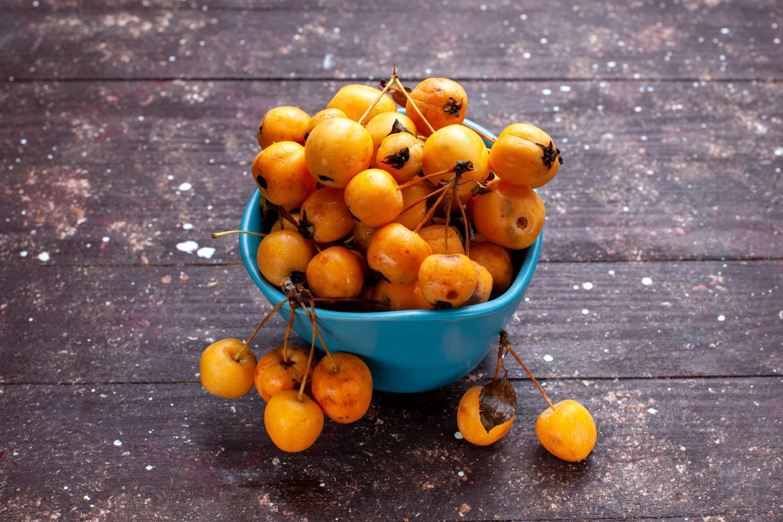 yellow cherries mellow fresh ripe inside blue bowl brown yellow cherries mellow fresh ripe inside blue bowl brown